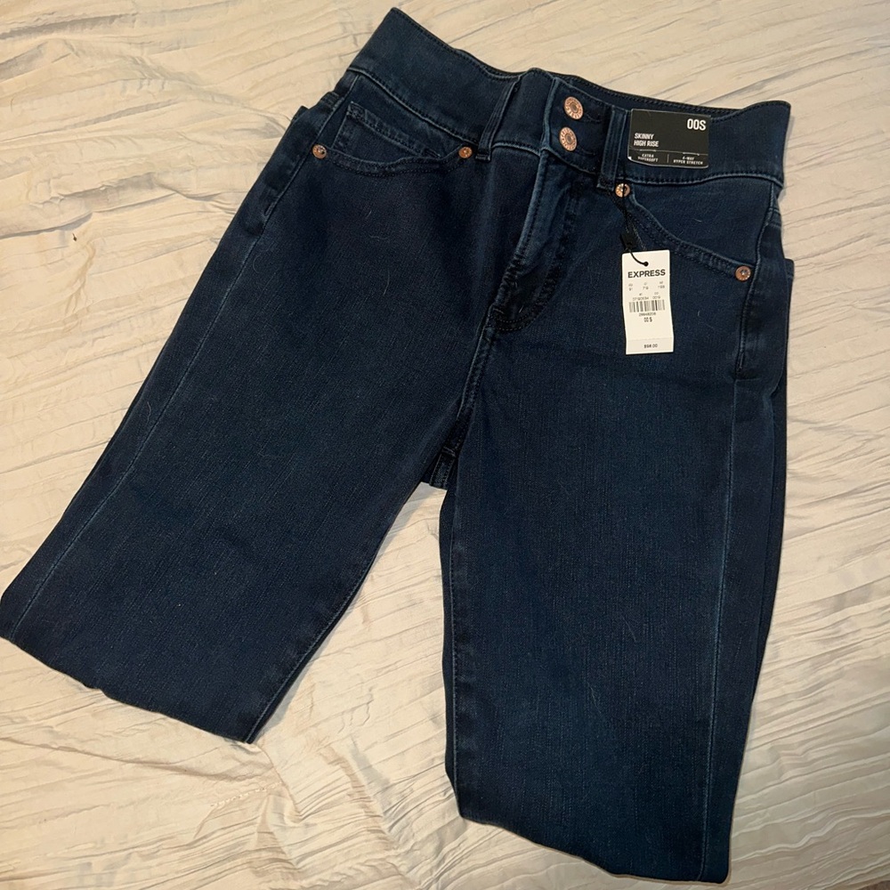 Express super skinny ripped jeans